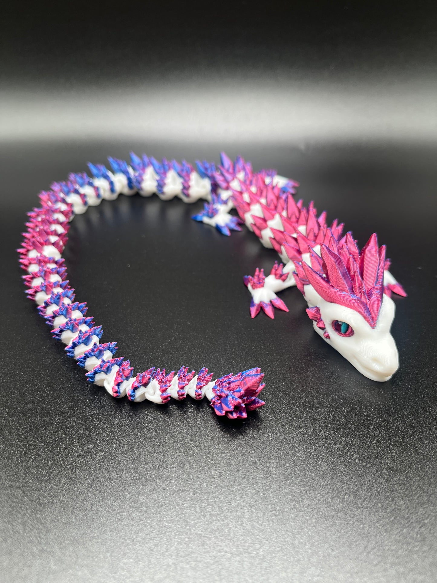 Color change crystal dragon in metallic egg.